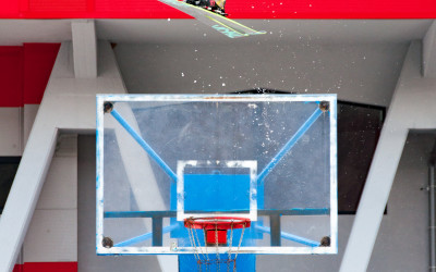 Ahmet Dadali gaps over a basketball hoop at the Podmežakla Sports Hall in Jesenice, Slovenia.