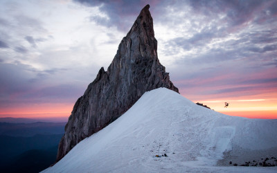 Tommy E. jumps into the sunset at Illumination Rock, Mount Hood, Oregon.